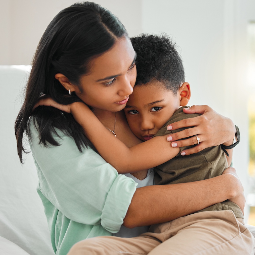 Shot of a young mother holding her sick little boy at home