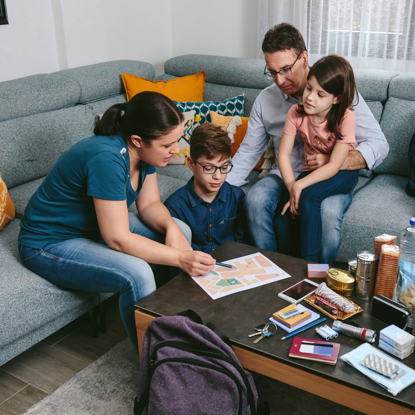 Mother explaining to her family the emergency assembly point