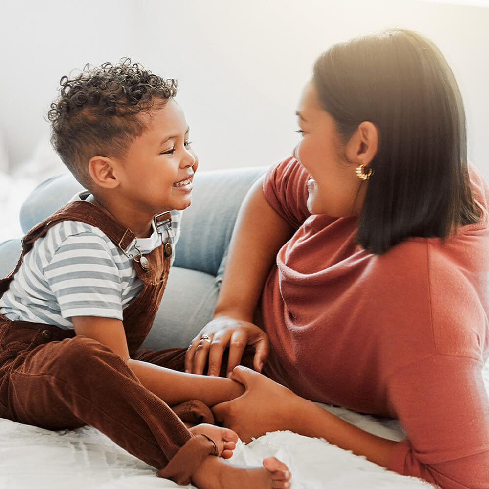 Woman talking with young boy.