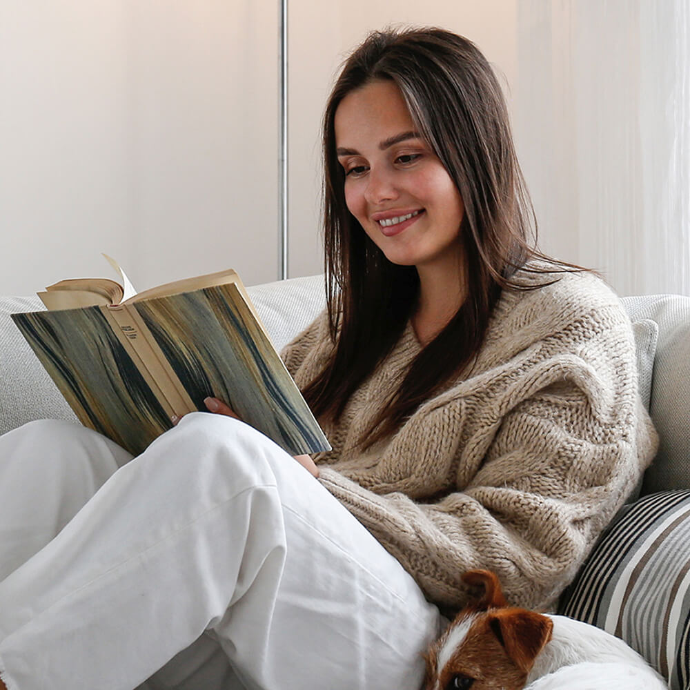 Young woman reading at home.