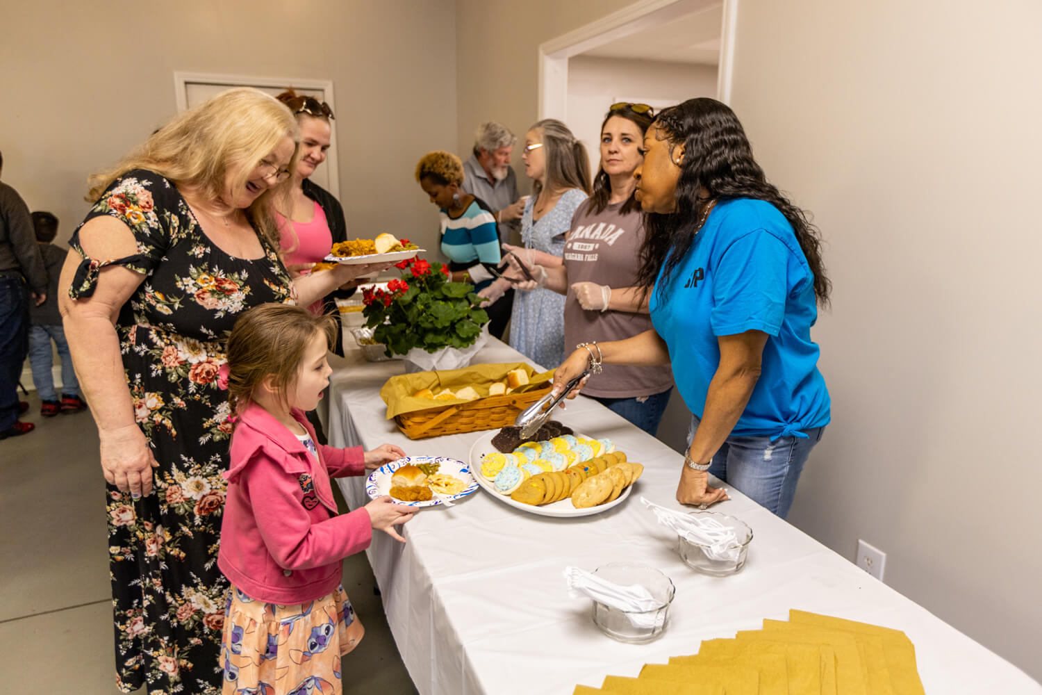 Happy Black Family Of Three Singing Having Fun Riding Car Families in line gather dinner at the Westview Behavioral Health, Strengthening Families Program graduation.