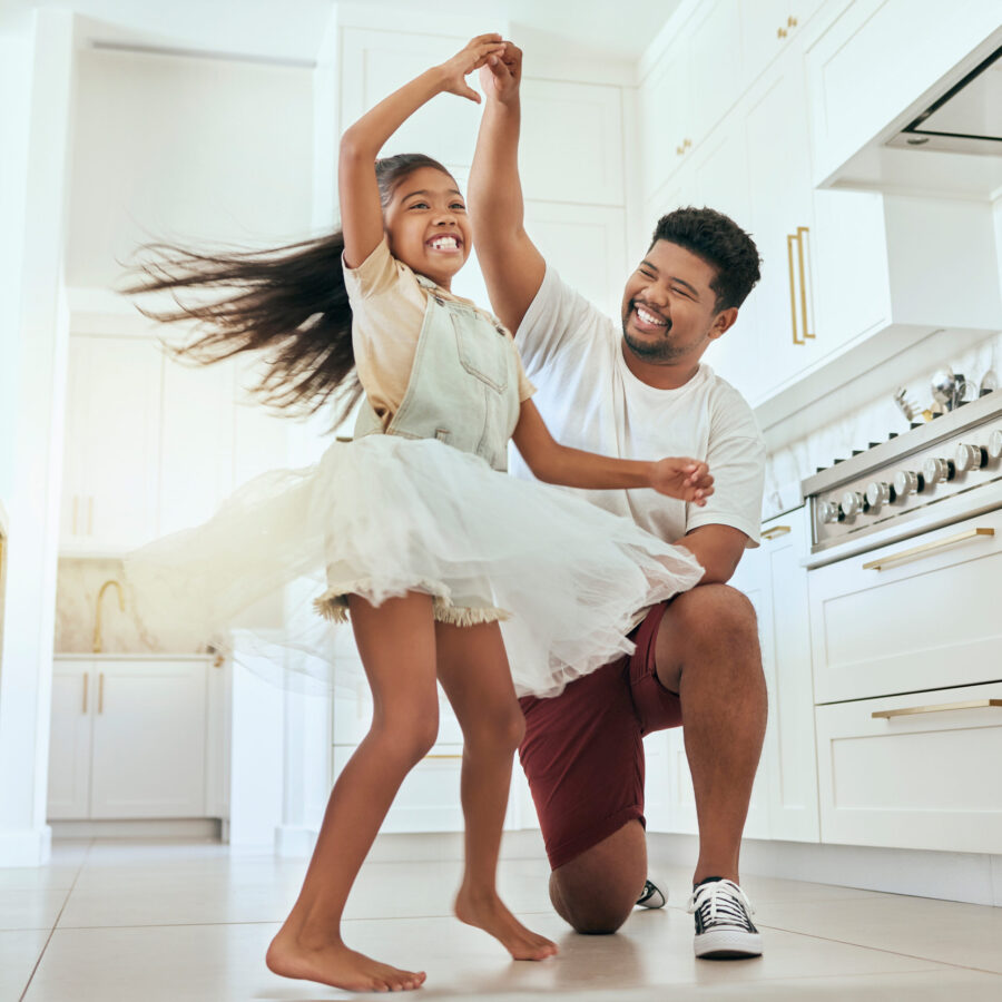 Love, dancing and father with girl in kitchen bonding, having fun and playing together. Family, affection and happiness in Indian dad with child dance, spin and relax in family home enjoying weekend